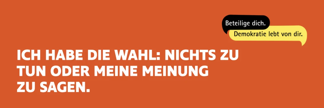 Vor einem orangenen Hintergrund steht in weißer Schrift: "Ich habe die Wahl: Nichts zu tun oder meine Meinung zu sagen."
